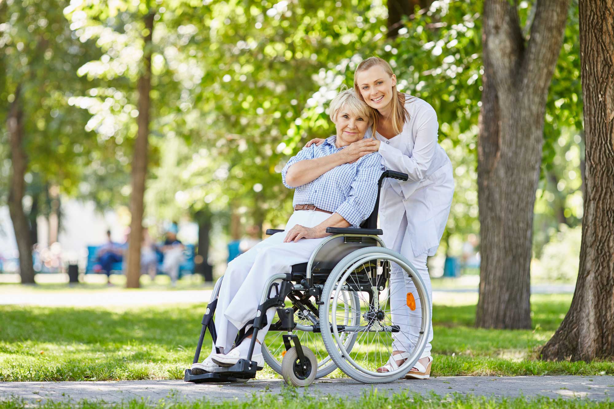 A Kirpa caregiver with a senior client outdoors